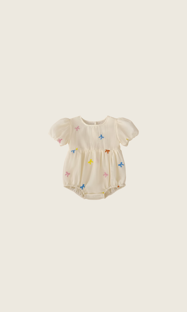 confetti bow romper | cream